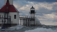 Waves Crash Against Lake Michigan Lighthouses 