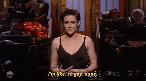 SNL gif. In monologue, Kristen Stewart fiddles with her hands and gestures "stop" while saying, "I'm like, so gay, dude," which appears as text.