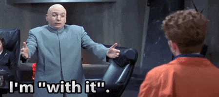 Movie gif. Mike Myers as Dr. Evil in Austin Powers puts out his arms and says "I'm with it, I'm hip," and then proceeds to do the macarena.