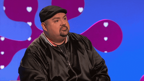Reality TV gif. Gabriel Iglesias is on The Celebrity Dating Game and he listens intently before furrowing his brow and looking around in shock.