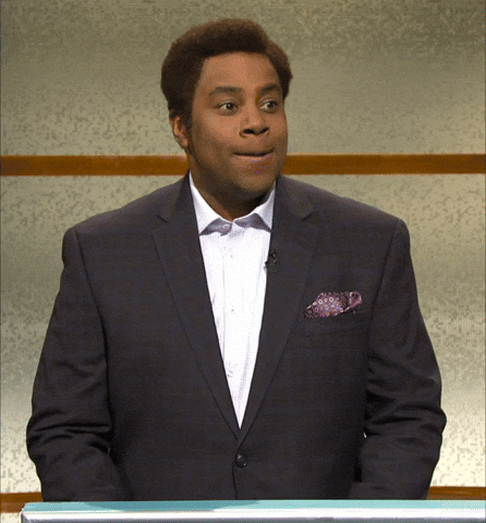 SNL gif. Wearing a suit, an angry Kenan Thompson holds back a smile and yells, “STOP IT.”