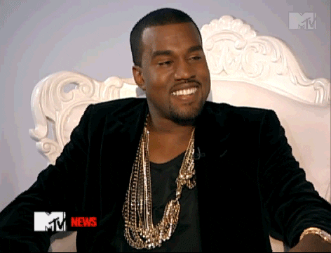 Celebrity gif. Kanye West laughs with shifty eyes, before his expression abruptly transforms into a pout.
