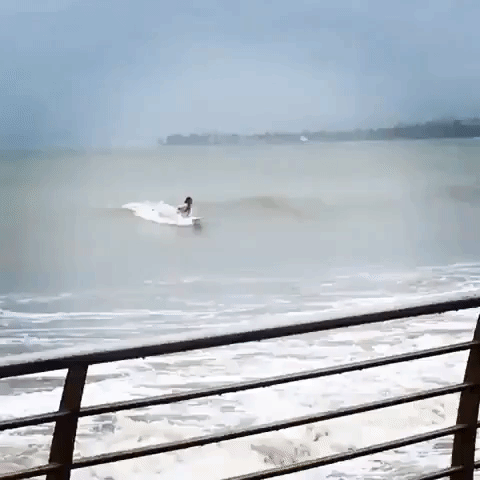 Flag-Flying Puerto Rican Surfer Makes Most of Waves as Tropical Storm Karen Nears