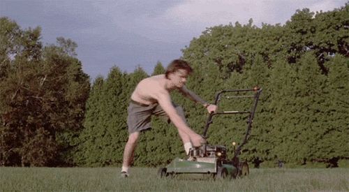 Video gif. A shirtless man in a field tries unsuccessfully to recoil start a lawn mower, violently pulling at the cord to try and get the engine to catch. This happens over and over again, never stopping. He'll never start that damn mower.