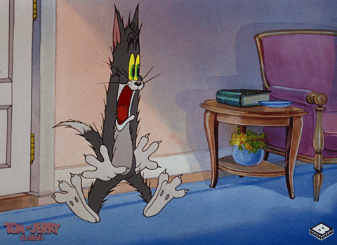 Cartoon gif. Jerry on Tom and Jerry shakes in terror as his limbs stay stiff and his eyes bug out. 