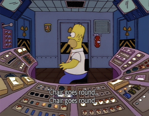 The Simpsons gif. Homer spins in his chair at his nuclear plant work station. Text, "Chair goes wrong. Chair goes wrong."