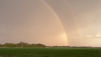 Lightning Flashes as Rainbow Arcs in Minnesota Sky