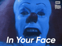 Sponsored gif. Pennywise the evil clown from It moves in close until all you can see is his wide-eyed face. In the upper right corner is the AMC Fear Fest logo. Text reads, “In your face.”
