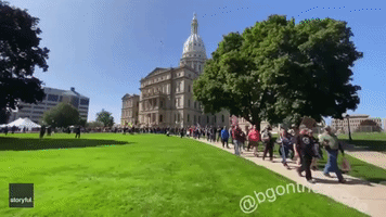 Hundreds March Carrying Firearms at Second Amendment Rally in Lansing