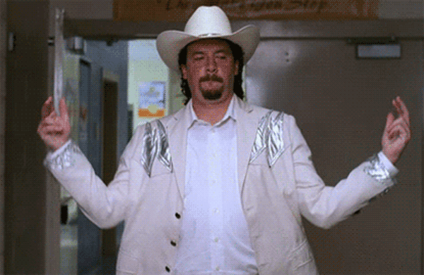 TV gif. Danny McBride as Kenny Powers wears a white cowboy hat and struts as he tosses his hands out to his side as finger guns. 
