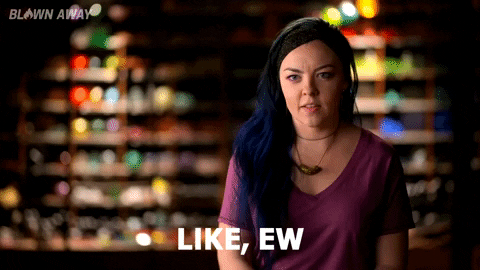 Reality TV gif. A contestant from Blown Away is being interviewed and she scrunches her nose in disgust while saying, "Eww."