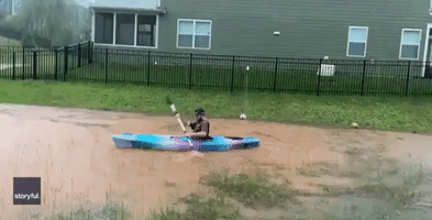 North Carolina Man Kayaks in Flooded Backyard