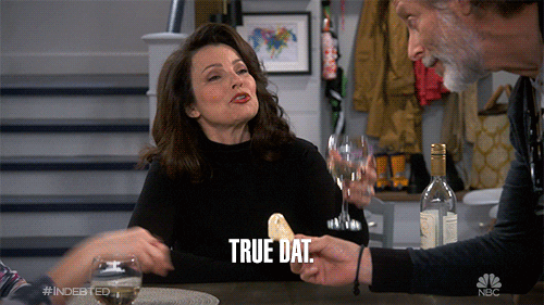 TV gif. Fran Drescher as Debbie on Indebted lifts a glass to cheers as she says, "True dat," then smiles contentedly.