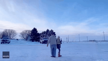 Minnesota Grandparents Face Off in Icy Water Gun Duel