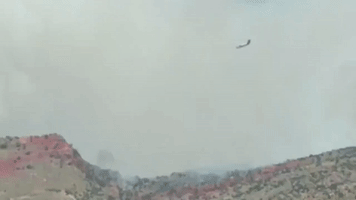 Firefighting Aircraft Drops Retardant on Bighorn Blaze near Tucson, Arizona
