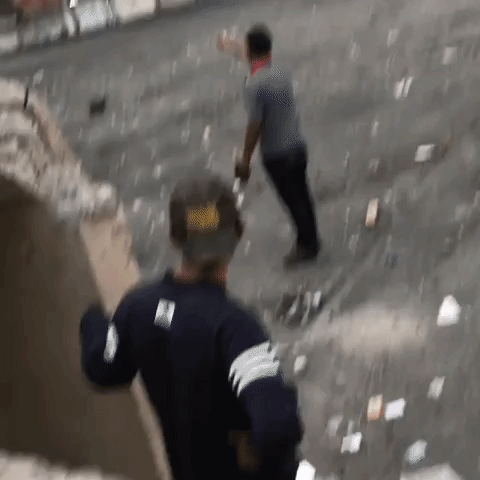 Baghdad Protesters Shine Laser Pointers at Security Forces in Debris-Strewn Khilani Square