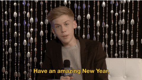 TV gif. Teen boy on New Year's Rockin' Eve points at us as he talks into a microphone, saying, "Have an amazing new year. And remember to be yourself because you is great."