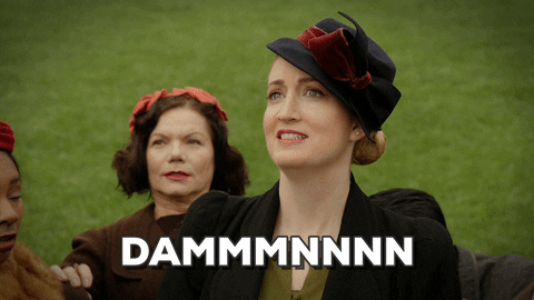 TV gif. On The Hindenburg Explodes, a woman along with a group of other people dressed in 1930s attire, looks impressed as she says in long drawn out way, "Damn"