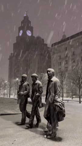 Snow Falls Over Beatles Statue in Liverpool 