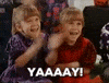 Movie gif. Mary Kate Olsen as Kelly and Ashley Olsen as Llynn in Double Double Toil and Trouble clap their little hands excitedly. Text, "Yay!"