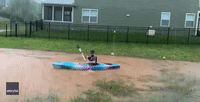 North Carolina Man Kayaks in Flooded Backyard
