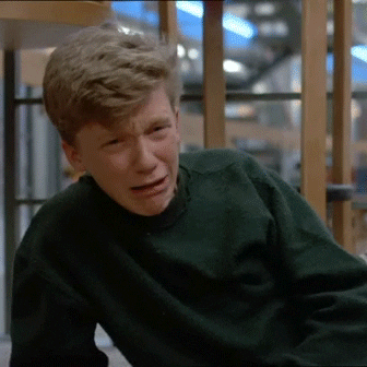 Movie gif. Anthony Michael Hall as Brian in The Breakfast Club lies on one elbow and looks at us crying, before wiping his eyes with the sleeve of his sweatshirt. 