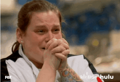 Reality TV gif. A contestant on Hell's Kitchen tears up as she crosses her palms on her chest, then lifts interlocked fingers to her face in a gesture of thanks.