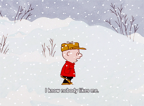 Peanuts gif. Charlie Brown trudging through the falling snow, says, “I know nobody likes me.”
