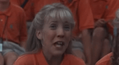 Movie gif. Mercedes McNab as Amanda Buckman from Addams Family Values screeches in excitement alongside another girl, putting her hands to her chest in exultation saying, "Me?!"