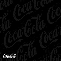Sponsored gif. An illustration of two red Coca-Cola bottles coming together in a toast. The Coca-Cola logo is in the bottom left corner. Text reads "Amigas" 