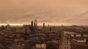 London Skyline Turns Orange as Ophelia Winds Carry Sahara Sand North