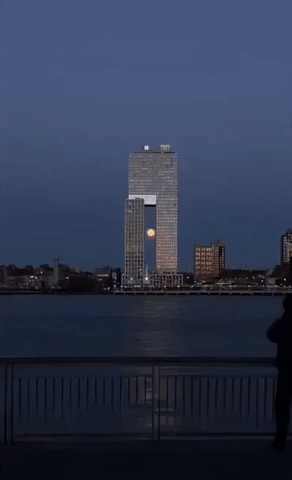 Pink Supermoon Caught Setting Behind Brooklyn Tower
