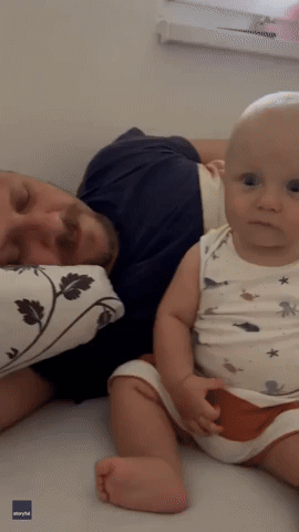 Baby Is Hilariously Bewildered by Dad's Thunderous Snore