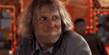 Movie gif. Actors Jeff Daniels and Jim Carrey in Dumb and Dumber exchange looks over a meal before erupting into exaggerated laughter. 