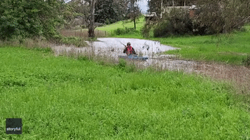 Kayaker Paddles Down Fast-Moving Creek Amid Flooding in South Australia