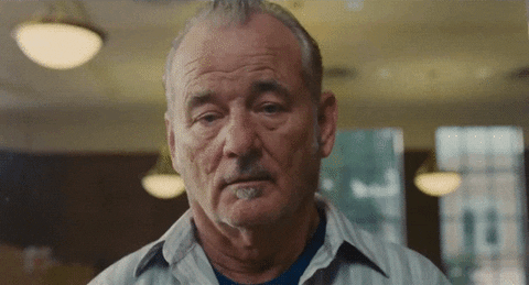 Celebrity gif. Bill Murray leans forward and hits his head on the transparent glass between us as he says, "Ok."