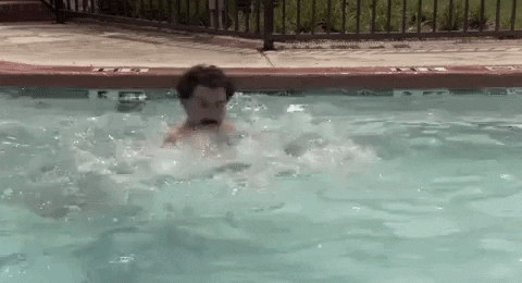 sacha baron cohen swimming GIF