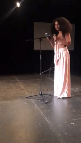 Woman Raps About Social Injustice at Open Mic Night