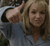 Celebrity gif. Young Britney Spears is throwing us a big thumbs up, pursing her lips and grinning.