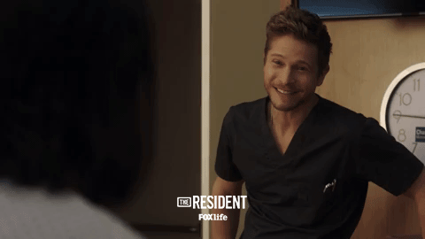 the resident smile GIF