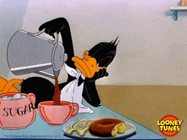 TV gif. A very sleepy Daffy Duck from Looney Tunes pours himself a cup of coffee at the breakfast table, barely able to keep his eyes open.