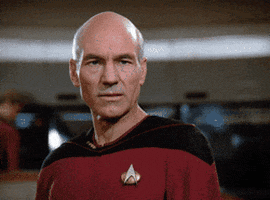 TV gif. Patrick Stewart as Jean-Luc Picard in Star Trek. The camera zooms in on his serious face and the text reads, "Damn."