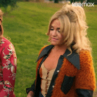 TV gif. Jessica Lowe as Bambi on Minx shakes her head, determined, walking with a woman through a park and says, "You just need to re-notch your groove. How do you feel about getting naked in the desert?"