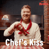 Sponsored gif. Smiling man with a red chef’s scarf around his neck shakes Frank’s RedHot sauce onto a pizza. Behind him, an actual chef appears and makes the “chef’s kiss” motion with his hand. A pair of hands can also be seen tossing pizza dough into the air. Text reads, “Chef’s kiss.”
