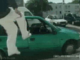 Video gif. A man jumps directly through the passenger window of a small car, feet first, with otherworldly agility, and lands in the seat with decisive ease. Text, "in."