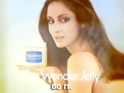 Ad gif. Vintage ad for Vaseline. Woman holds a tub of Vaseline and tell us, "Do it." The text at the bottom reads, "The Wonder Jelly."