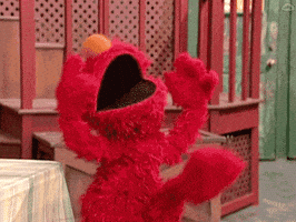 Sesame Street gif. Elmo dances gleefully with his head back, mouth gaping open, and arms in the air as his legs flutter.