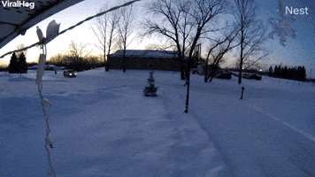 Snowmobile Crashes Into Garage