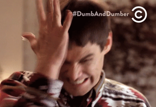 Movie gif. Jim Carrey as Lloyd in Dumb and Dumber grits his teeth and winces as he hits himself repeatedly on his head with his hand. 