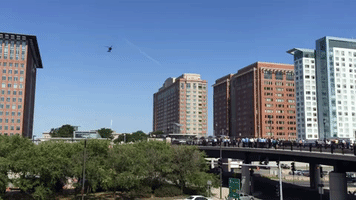 Crowd Watches Blackhawk Helicopter Landing in Boston
